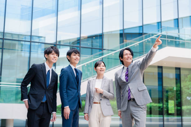 istock Business people pointing to the future with a smile 2155851306