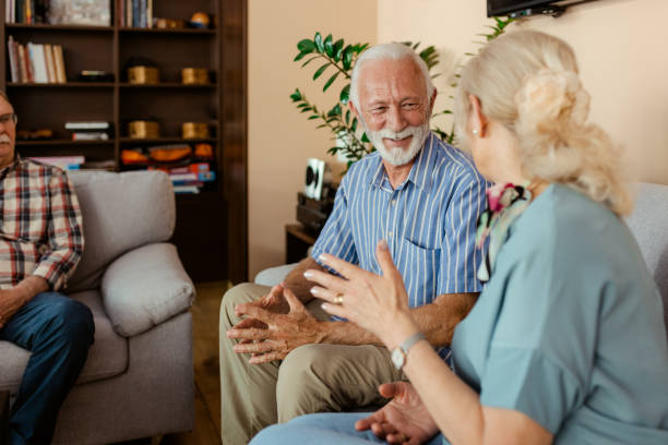 istock Happy Senior Couple Talking at Retirement Home 2155851863