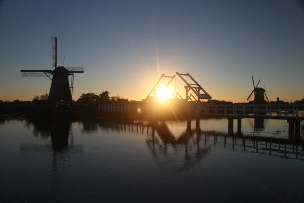 Traditional Dutch windmill canal sunset Netherlands Holland