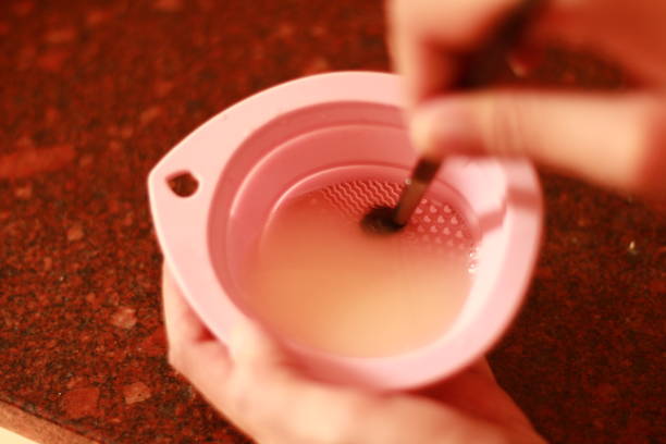 istock Person Cleaning their Makeup Brush 2155854044