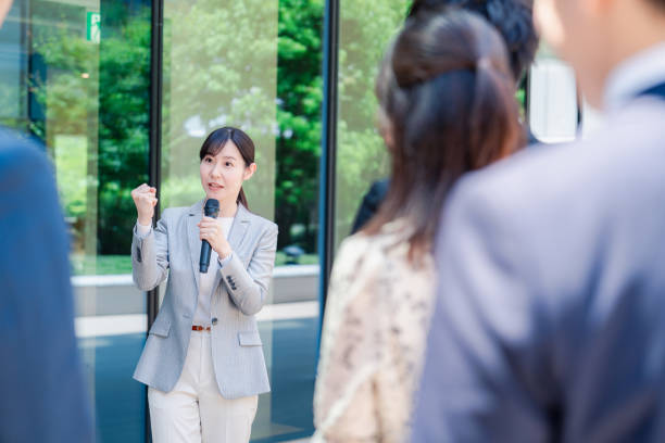 istock Young woman speaking with microphone 2155858576
