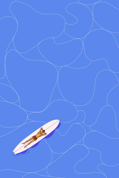 istock Muscular relaxed young man lying on board on blue water background, sunbathing and enjoying. Contemporary art collage. 2155860040