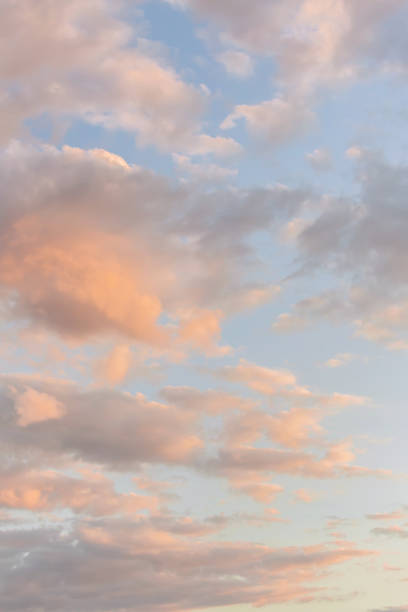 istock Pastel sunset sky with soft pink and blue hues among fluffy clouds, offering a gradient of warm to cool tones. Nature vertical wallpaper or background 2155862331