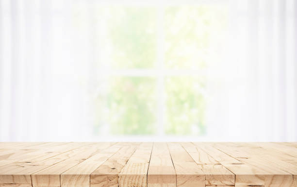 istock Selective focus.Wood table counter on blur curtain window in morning background. 2155863209