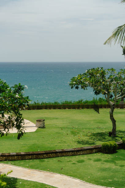 istock Vibrant Garden Overlooking the Ocean with Blue Sky 2155863603