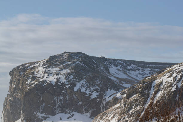 istock Frozen waterfall in a snowy mountain landscape in Iceland 2155865322