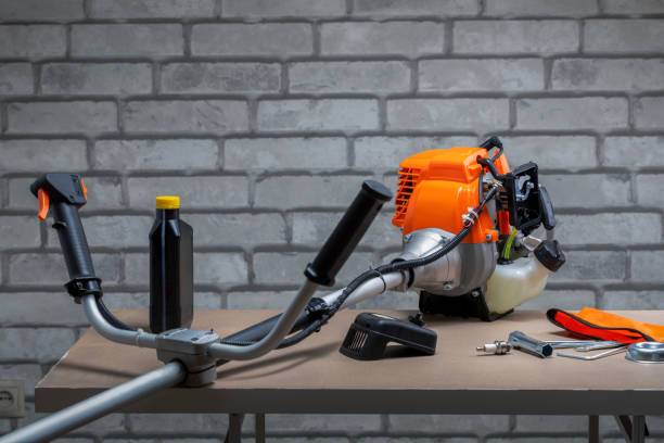 istock Lawnmower with tools on the workbench inwork shop. Maintenance, support service concept. 2155866354