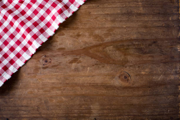 istock red tablecloth on wooden background 2155868339