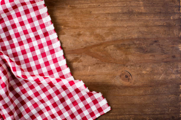 istock red tablecloth on wooden background 2155868347