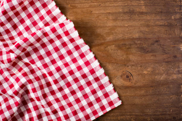istock red tablecloth on wooden background 2155868348