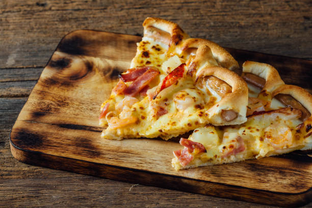 istock pizza on wooden background 2155868647