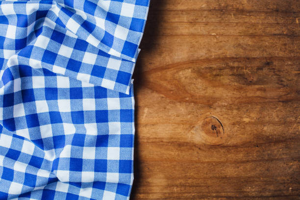 istock blue tablecloth on wooden background 2155868738
