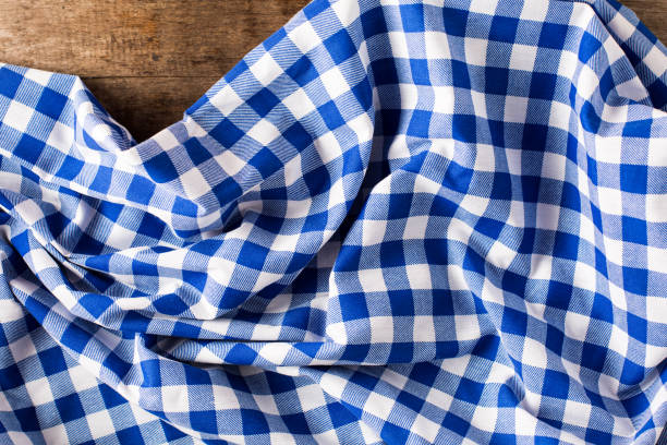 istock blue tablecloth on wooden background 2155868851