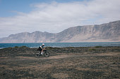 gravel-bicyclist-rides-through-desert-landscape.jpg?b=1&s=170x170&k=20&c=75MpaUob0B8HgPAikLkKmWoQts4NYINbcvcGt0jzZcs=