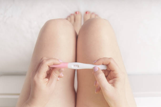 istock Woman holding in hands pregnancy test. 2155870156