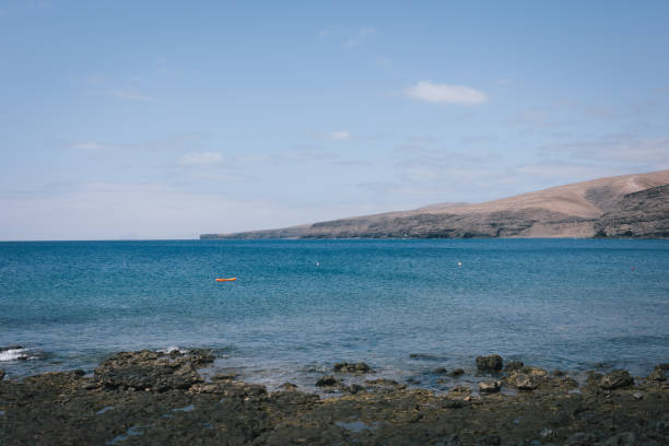 istock Tranquil bay and desert landscape 2155870180