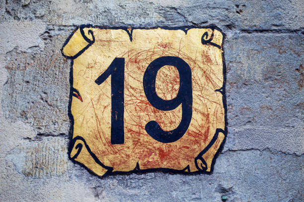 istock Nineteen decorative street number on a wall 2155870324