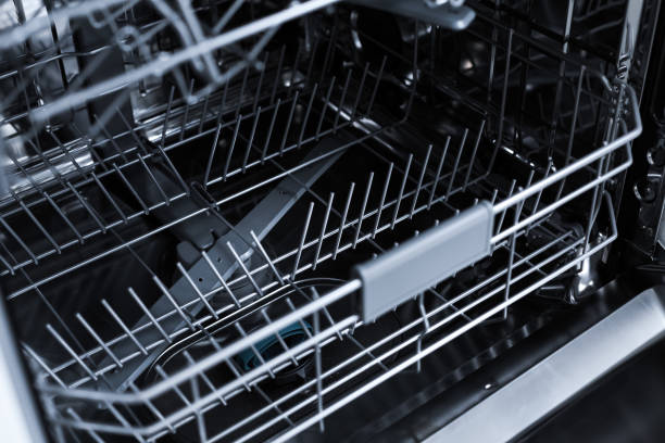 istock Crop of drawer in empty dishwasher 2155871652