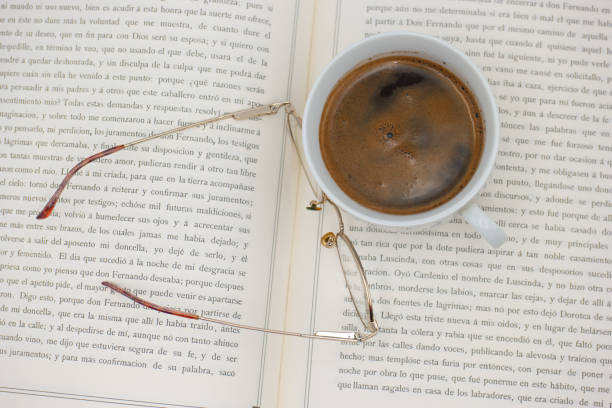 Work table with keyboard, lens, cup of coffee, пен, eyeglasses and sweets, top view