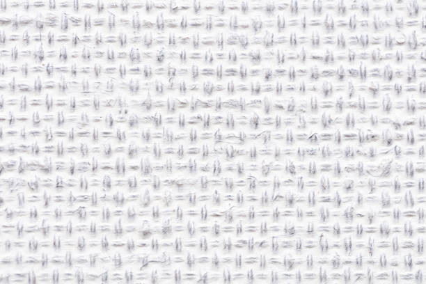 White color fabric canvas woven texture background in pattern light blank. Natural gauze linen, carpet wool and cotton cloth textile textured as clean empty for decoration text. Grey sack material.