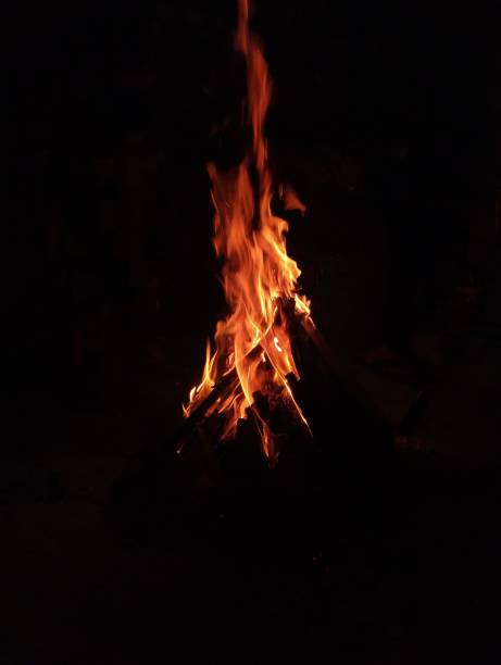 istock Bright bonfire glowing in the darkness 2155876363
