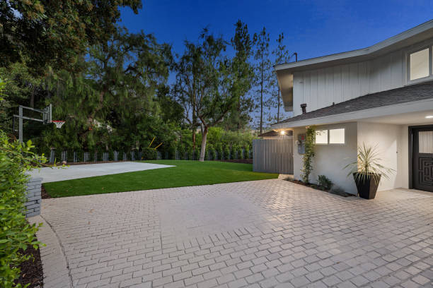 istock Remodeled Los Angeles home yard with lush trees 2155877103