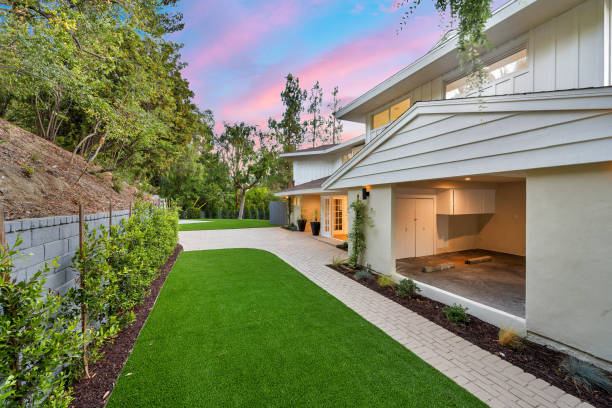 istock Remodeled Los Angeles home yard with lush trees 2155877170