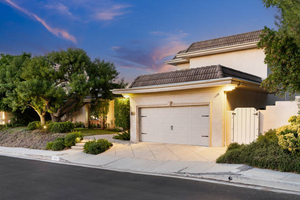 istock House at dusk, surrounded by greenery in Encino, California 2155877603