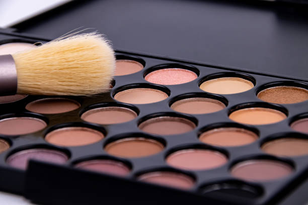 Cosmetics eye shadow with brush close-up