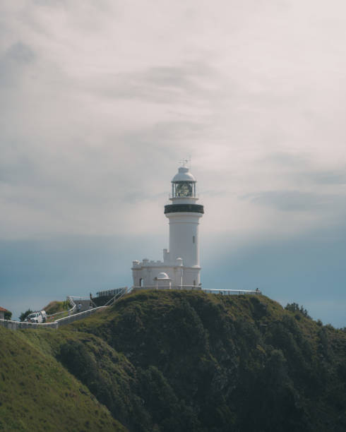 istock Black and white lighthouse atop a hill by the Byron bay 2155878129