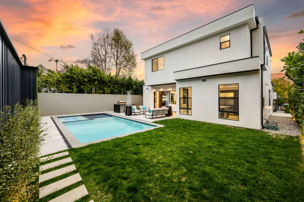 istock the pool is empty and there are green grass around it 2155879243