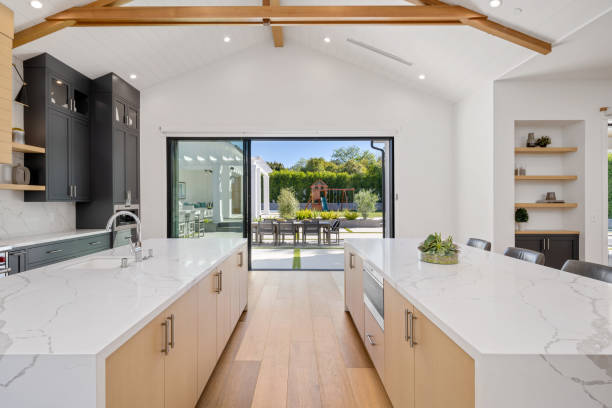 istock an all white kitchen with natural wood and a large dining area 2155879362