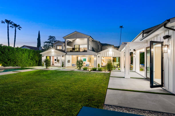 istock a backyard with green grass and a swimming pool on either side 2155879375