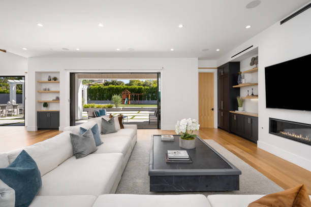 istock a white couch sitting next to a black coffee table in a living room 2155879423