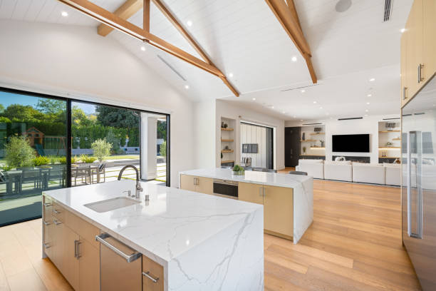 istock modern kitchen with white marble counters and bar stools for outdoor dining 2155879517
