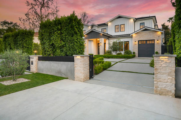 istock White luxury house with a stone facade and driveway. 2155879519