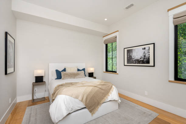 istock a bed that is in a bedroom with a wooden floor 2155879538