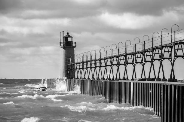 istock Grayscale of a lighthouse on a stormy sea 2155882449