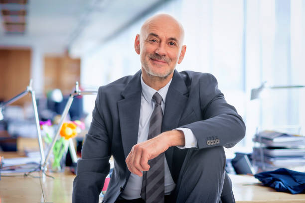 istock Successful businessman sitting in his office 2155883485