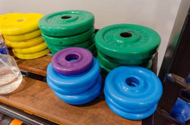 Weights and water bottles on a gym floor