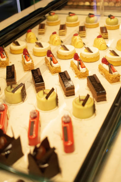 istock Close-up of various sweets and pastries displayed on shelves in a bakery 2155885821