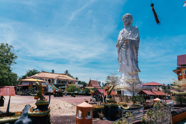 istock Wat Phothikyan Phutthaktham Thai White Buddha Statue in Kota Bharu, Malaysia 2155886637