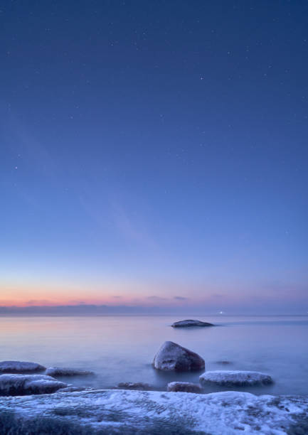 istock Vertical of a rocky coastline at sunset 2155886757