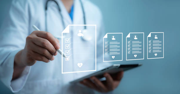 istock Medical worker working with medical document online concept.Patient history, examination, treatment, medical and health concept.EMR Electronic Medical Record.Technology and access information. 2155886829