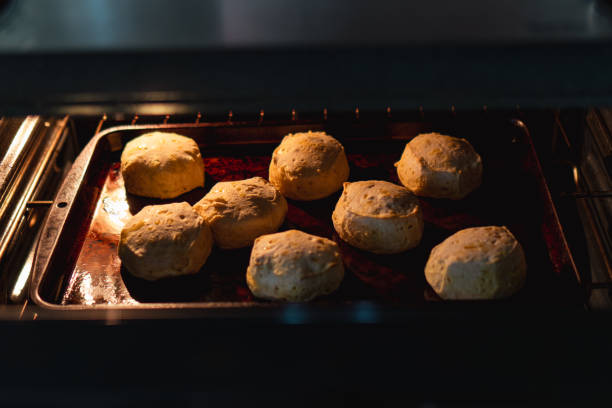 istock Balls of dough baking in oven at night 2155887041