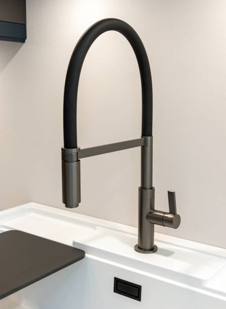 istock A modern faucet and sink on a bright marble countertop. 2155890772