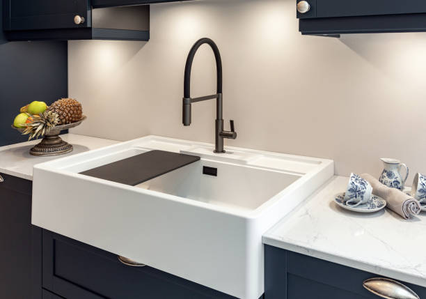 istock A modern faucet and sink on a bright marble countertop. 2155890824