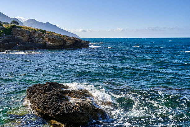 istock Rocky shore in Sicily is surrounded by mountains 2155892546