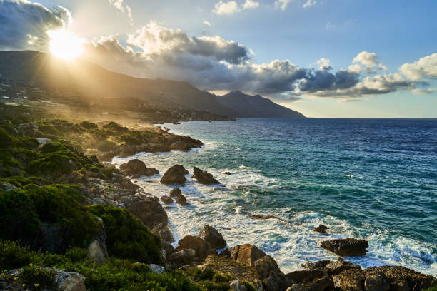 istock Sunlight illuminates water from rocky shores overlook 2155892555