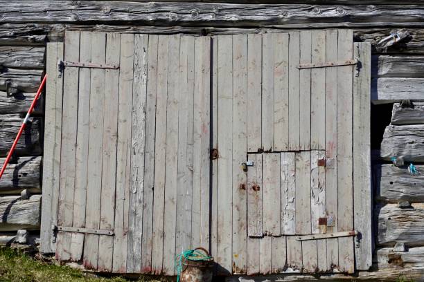Wooden door of demolishing abandoned house, locked